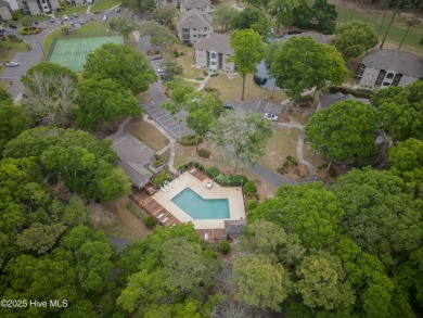 Nestled in the heart of Sunset Beach, this beautifully furnished on Oyster Bay Golf Links in North Carolina - for sale on GolfHomes.com, golf home, golf lot