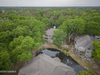Nestled in the heart of Sunset Beach, this beautifully furnished on Oyster Bay Golf Links in North Carolina - for sale on GolfHomes.com, golf home, golf lot