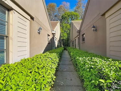 Palm Harbor - Nestled in the gated community of Wescott Square on Tarpon Woods Golf Club in Florida - for sale on GolfHomes.com, golf home, golf lot