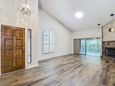 Palm Harbor - Nestled in the gated community of Wescott Square on Tarpon Woods Golf Club in Florida - for sale on GolfHomes.com, golf home, golf lot