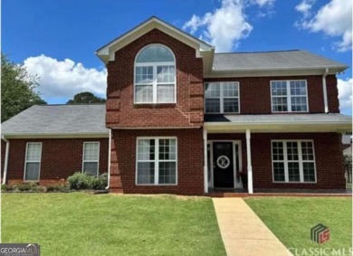 Enjoy life in this beautiful all-brick, low maintenance home in on Jennings Mill Country Club in Georgia - for sale on GolfHomes.com, golf home, golf lot