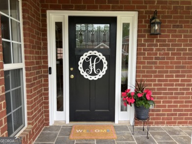 Enjoy life in this beautiful all-brick, low maintenance home in on Jennings Mill Country Club in Georgia - for sale on GolfHomes.com, golf home, golf lot