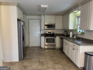Enjoy life in this beautiful all-brick, low maintenance home in on Jennings Mill Country Club in Georgia - for sale on GolfHomes.com, golf home, golf lot