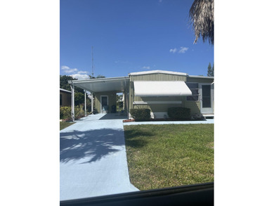 2/1 Mobile home in beautiful Spanish Lakes. Updated kitchen on Spanish Lakes I in Florida - for sale on GolfHomes.com, golf home, golf lot