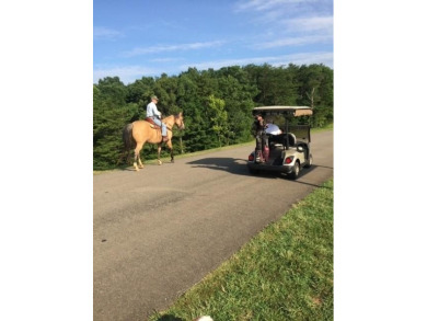 This 1.34 acre wooded lot is located close to the front gate of on Bent Tree Golf Course in Georgia - for sale on GolfHomes.com, golf home, golf lot