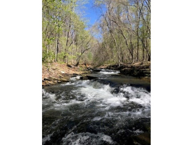 This 1.34 acre wooded lot is located close to the front gate of on Bent Tree Golf Course in Georgia - for sale on GolfHomes.com, golf home, golf lot