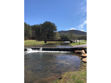 This 1.34 acre wooded lot is located close to the front gate of on Bent Tree Golf Course in Georgia - for sale on GolfHomes.com, golf home, golf lot