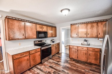 This gorgeous Cape Cod Colonial home is located in the heart of on Tri Cities Golf Club in Tennessee - for sale on GolfHomes.com, golf home, golf lot