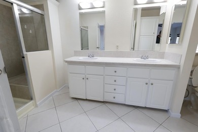 RARE CORNER-LOT WATERFRONT HOME WITH WRAPAROUND WATER AND GOLF on Savanna Golf Club in Florida - for sale on GolfHomes.com, golf home, golf lot