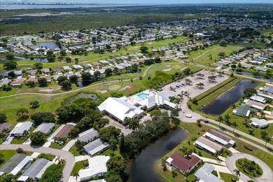 Rare corner-lot waterfront gem with wraparound water and golf on Savanna Golf Club in Florida - for sale on GolfHomes.com, golf home, golf lot