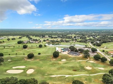 IN THE ESTATES OF BLACK BEAR RESERVE, A CHARMING HOME SITS ON on Black Bear Golf Club in Florida - for sale on GolfHomes.com, golf home, golf lot