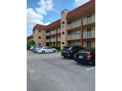 Beautiful 2 bedroom, 2 bath luxury condo with a scenic lake view on Sunrise Lakes Phase III in Florida - for sale on GolfHomes.com, golf home, golf lot