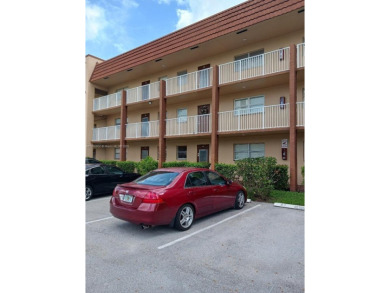 Beautiful 2 bedroom, 2 bath luxury condo with a scenic lake view on Sunrise Lakes Phase III in Florida - for sale on GolfHomes.com, golf home, golf lot