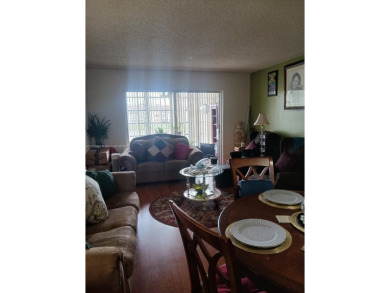 Beautiful 2 bedroom, 2 bath luxury condo with a scenic lake view on Sunrise Lakes Phase III in Florida - for sale on GolfHomes.com, golf home, golf lot