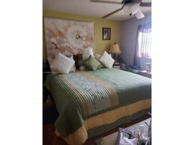 Beautiful 2 bedroom, 2 bath luxury condo with a scenic lake view on Sunrise Lakes Phase III in Florida - for sale on GolfHomes.com, golf home, golf lot