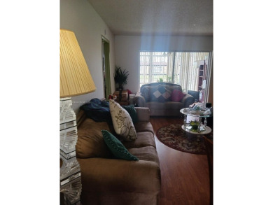 Beautiful 2 bedroom, 2 bath luxury condo with a scenic lake view on Sunrise Lakes Phase III in Florida - for sale on GolfHomes.com, golf home, golf lot