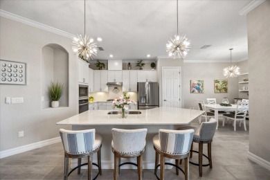 Discover the perfect blend of comfort, elegance, and Florida on Ritz-Carlton Members Golf Club in Florida - for sale on GolfHomes.com, golf home, golf lot