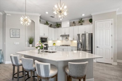 Discover the perfect blend of comfort, elegance, and Florida on Ritz-Carlton Members Golf Club in Florida - for sale on GolfHomes.com, golf home, golf lot
