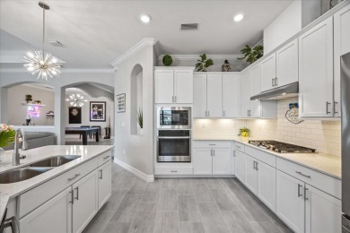 Discover the perfect blend of comfort, elegance, and Florida on Ritz-Carlton Members Golf Club in Florida - for sale on GolfHomes.com, golf home, golf lot