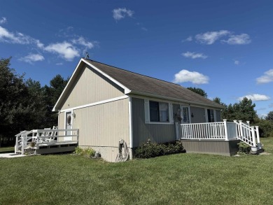 Welcome to your up north getaway! This charming 2-bedroom on Lakeside Golf Course in Michigan - for sale on GolfHomes.com, golf home, golf lot