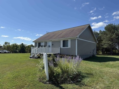 Welcome to your up north getaway! This charming 2-bedroom on Lakeside Golf Course in Michigan - for sale on GolfHomes.com, golf home, golf lot