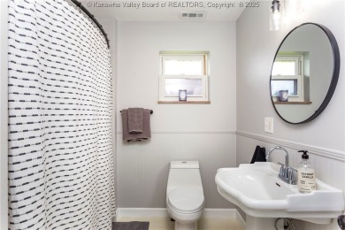 Charming one-level brick rancher, beautifully updated and on Riviera Country Club in West Virginia - for sale on GolfHomes.com, golf home, golf lot