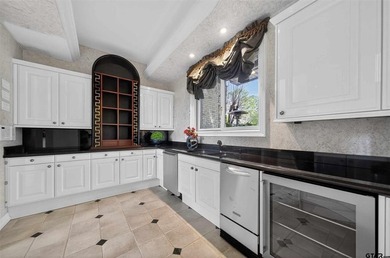 Nestled on a rare, sprawling one acre, corner lot overlooking on Hollytree Country Club in Texas - for sale on GolfHomes.com, golf home, golf lot