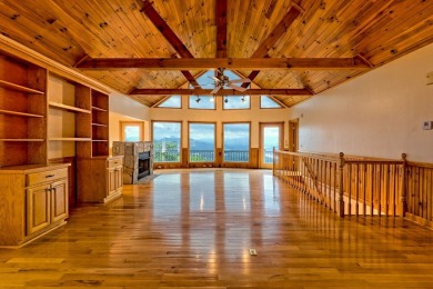 Breathtaking views abound from this 3-bedroom, 3.5-bath home on on Chatuge Shores Golf Course in North Carolina - for sale on GolfHomes.com, golf home, golf lot