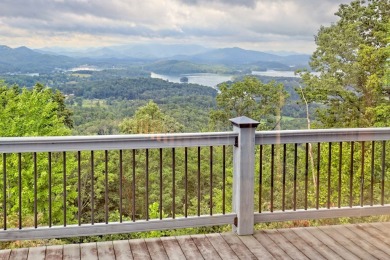 Breathtaking views abound from this 3-bedroom, 3.5-bath home on on Chatuge Shores Golf Course in North Carolina - for sale on GolfHomes.com, golf home, golf lot