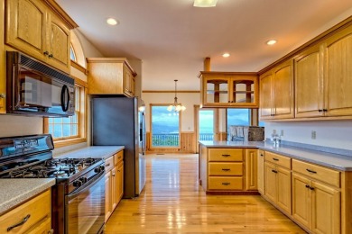 Breathtaking views abound from this 3-bedroom, 3.5-bath home on on Chatuge Shores Golf Course in North Carolina - for sale on GolfHomes.com, golf home, golf lot