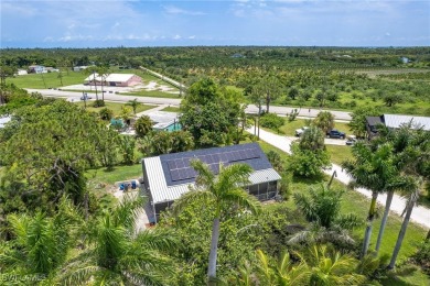 Island Charm Meets Modern Comfort - Welcome to 7256 Victory Road on Alden Pines Golf Club in Florida - for sale on GolfHomes.com, golf home, golf lot