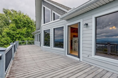 Breathtaking views abound from this 3-bedroom, 3.5-bath home on on Chatuge Shores Golf Course in North Carolina - for sale on GolfHomes.com, golf home, golf lot