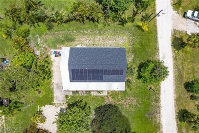 Island Charm Meets Modern Comfort - Welcome to 7256 Victory Road on Alden Pines Golf Club in Florida - for sale on GolfHomes.com, golf home, golf lot