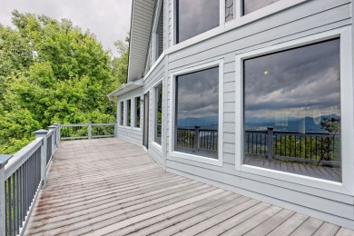 Breathtaking views abound from this 3-bedroom, 3.5-bath home on on Chatuge Shores Golf Course in North Carolina - for sale on GolfHomes.com, golf home, golf lot