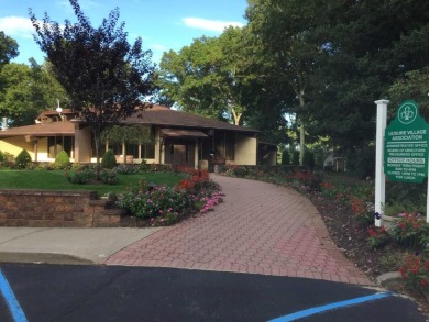 This lovely Baronet model is an end-unit with tasteful upgrades on Leisure Village Golf Course in New York - for sale on GolfHomes.com, golf home, golf lot
