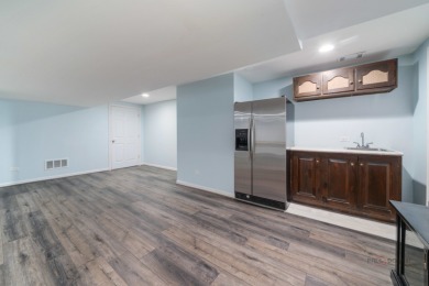 Welcome to this exceptional 5-bedroom, 4.1-bathroom residence on Hillcrest Country Club in Illinois - for sale on GolfHomes.com, golf home, golf lot