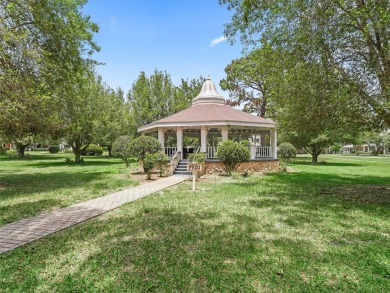 This spacious 2-bedroom, 2 1/2 -bathroom townhome is nestled in on On Top of the World Golf Course in Florida - for sale on GolfHomes.com, golf home, golf lot