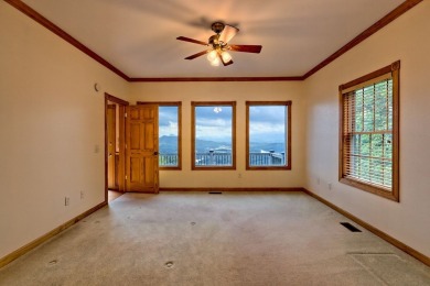 Breathtaking views abound from this 3-bedroom, 3.5-bath home on on Chatuge Shores Golf Course in North Carolina - for sale on GolfHomes.com, golf home, golf lot