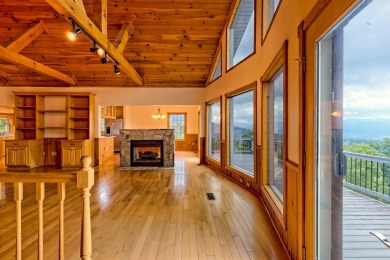 Breathtaking views abound from this 3-bedroom, 3.5-bath home on on Chatuge Shores Golf Course in North Carolina - for sale on GolfHomes.com, golf home, golf lot