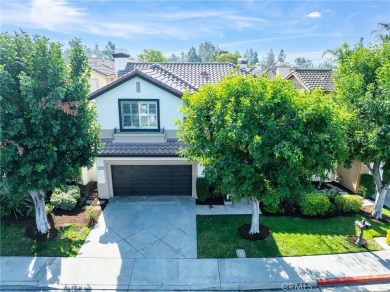 Nestled in the charming tree-lined golf-course community of on Tustin Ranch Golf Club in California - for sale on GolfHomes.com, golf home, golf lot