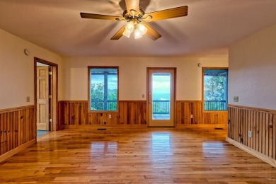 Breathtaking views abound from this 3-bedroom, 3.5-bath home on on Chatuge Shores Golf Course in North Carolina - for sale on GolfHomes.com, golf home, golf lot