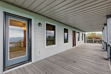 Breathtaking views abound from this 3-bedroom, 3.5-bath home on on Chatuge Shores Golf Course in North Carolina - for sale on GolfHomes.com, golf home, golf lot