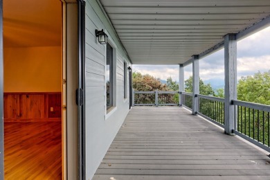 Breathtaking views abound from this 3-bedroom, 3.5-bath home on on Chatuge Shores Golf Course in North Carolina - for sale on GolfHomes.com, golf home, golf lot
