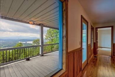 Breathtaking views abound from this 3-bedroom, 3.5-bath home on on Chatuge Shores Golf Course in North Carolina - for sale on GolfHomes.com, golf home, golf lot