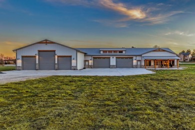 Welcome to a car enthusiast's paradise! This one-of-a-kind home on Jester Park Golf Course in Iowa - for sale on GolfHomes.com, golf home, golf lot