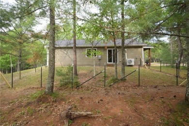 Welcome to your serene Northwoods escape in the heart of Voyager on Voyager Village Country Club - Voyager in Wisconsin - for sale on GolfHomes.com, golf home, golf lot
