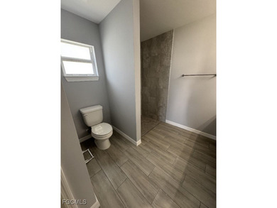 Charming and cozy 4-bedroom, 2 full bath home featuring a on Copperhead Golf Club in Florida - for sale on GolfHomes.com, golf home, golf lot