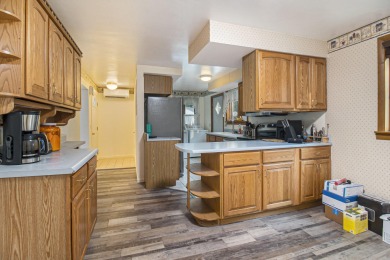 Hamlin Township - This 3-bedroom, 2-bath home sits on 1.5 wooded on Lincoln Hills Golf Club in Michigan - for sale on GolfHomes.com, golf home, golf lot