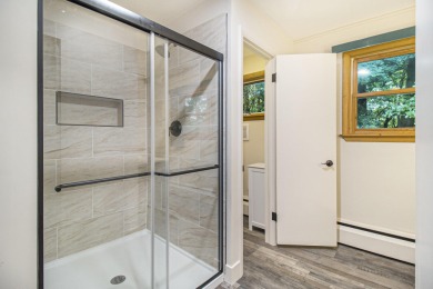 Hamlin Township - This 3-bedroom, 2-bath home sits on 1.5 wooded on Lincoln Hills Golf Club in Michigan - for sale on GolfHomes.com, golf home, golf lot