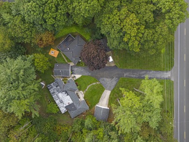 Hamlin Township - This 3-bedroom, 2-bath home sits on 1.5 wooded on Lincoln Hills Golf Club in Michigan - for sale on GolfHomes.com, golf home, golf lot